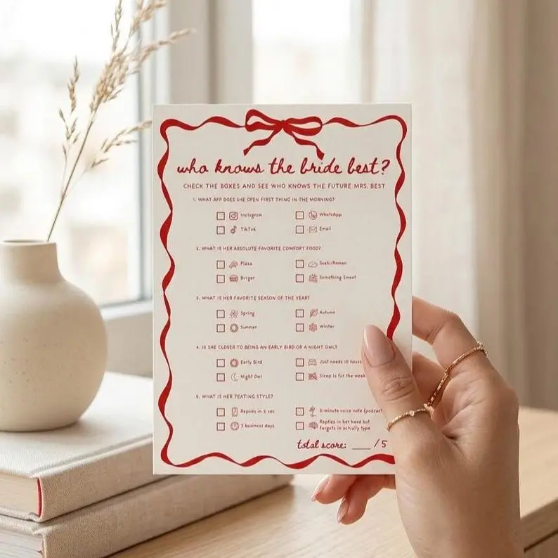 Who Knows The Bride Best quiz card on cream with a red wavy ribbon border and bow, holding five multiple choice questions with small illustrated options and a score line